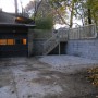 side of house with garage, parking area , steps to rear from Noble a