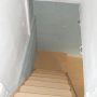 view down steps into basement