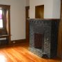 view of decorative fireplac ein living room from bedroom 2 doorway