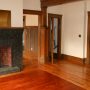 view of decorative fireplace in living room , and closet, and doorway to bedroom 2 from inside living room