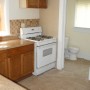 oven and view of half bathroom