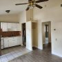 view of kitchen, and bedroom doorway and closet from living room