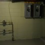 Separate apartment water meters and electric service panel boxes in basement