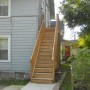 rear stair up to rear deck with door to kitchen