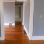 view through dining room of rear door in kitchen from living room